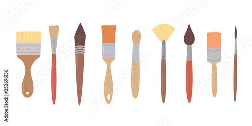 Drawing tools, set paint brushes in row on white isolated background. Artist painting materials.