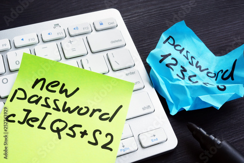 Strong and weak password on pieces of paper. Password security and protection.