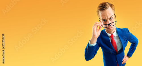 portrait of funny skeptic young businessman