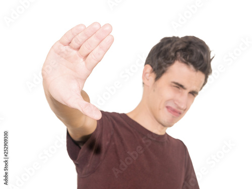 Portrait disgusted young man. Negative human emotion. Isolated on a white background.