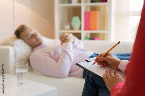 Man lying in couch during hypnotherapy