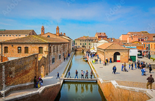 Beautiful colorful houses and water channels in Comacchio town in Emilia-Romagna region