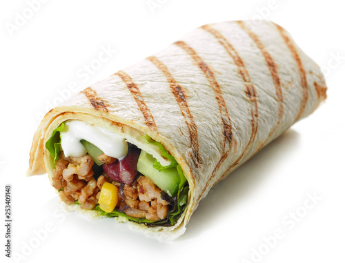 Tortilla wrap with fried minced meat and vegetables