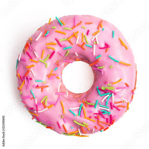 Flat lay pink donut decorated with colorful sprinkles isolated on white background. Sweet donut on white. Top view