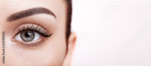 Female Eye with Extreme Long False Eyelashes. Eyelash Extensions. Makeup, Cosmetics, Beauty. Close up, Macro