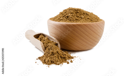 garam masala mix in wooden bowl and scoop isolated on white background. Spices and food ingredients.