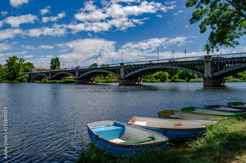 Rio Tormes with boats and Enrique Esteban bridge in Salamanca