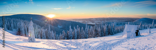 Polish Winter landscape in the mountains, snowy trees and roads.