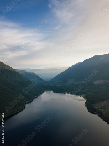 Aerial view of a scenic lake in the Canadian Mountain Landscape during a vibrant summer sunrise. Taken at Jones Lake near Chilliwack and Hope, East of Vancouver, BC, Canada.