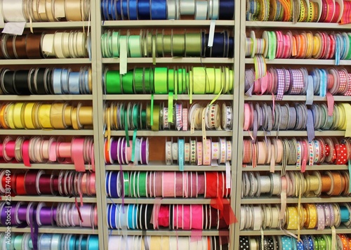 sewing haberdashery haberdasher ribbon reels rolls rows and trims in fabric retail shop sew sewing supplies for sale retail shop market rainbow stock, photo, photograph, image, picture, 