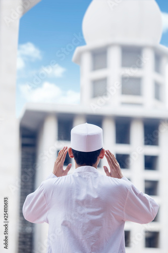 Muslim man doing azan in the mosque