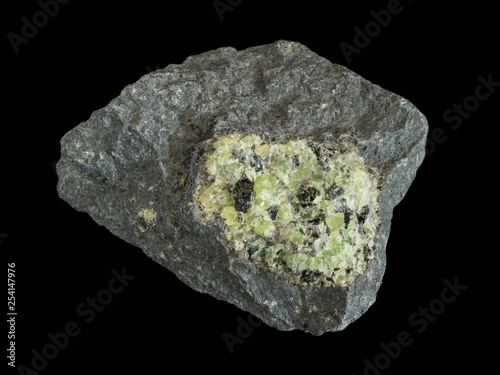 Green peridote (olivine) in dark basalt rock