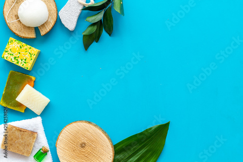 homemade spa with woman cosmetics on blue background top view copyspace