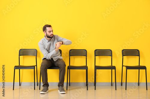 Young man waiting for job interview indoors