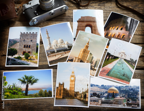 Old retro pictures and camera on wooden table globetrotter photography travel collage concept