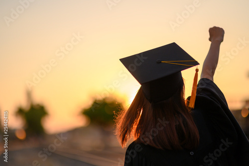 Graduates wear a black dress, black hat at the university level.