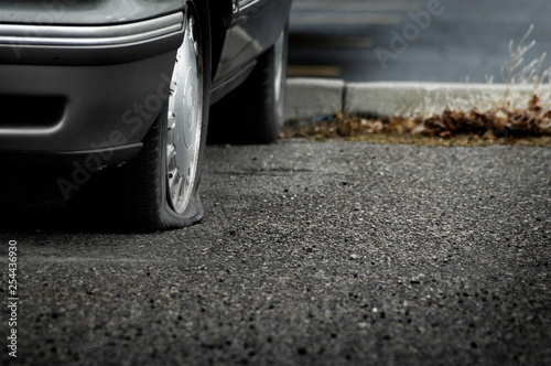 Flat Tire on Car Roadside Danger Travel Transportation