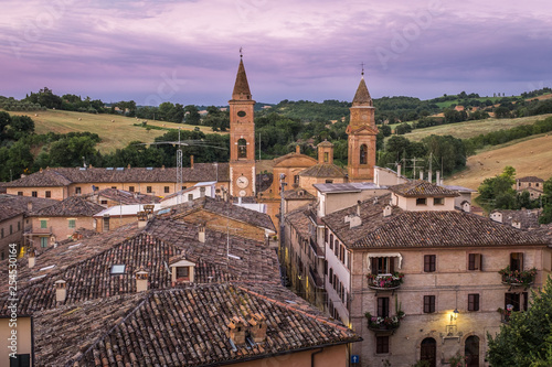A sweeping view across the roof tops to the church of the small and beautiful Italian town of Caldarola, Le Marche, at sunset