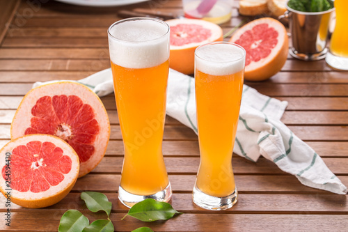 glass of sour Grapefruit Craft Beer on wooden table