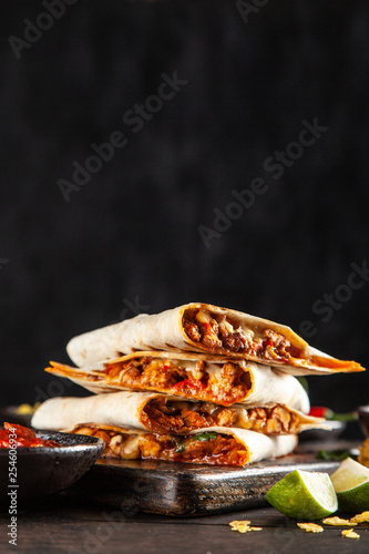 Chicken quesadillas with paprika, cheese and cilantro