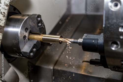 metal blank machining process on lathe with cutting tool
