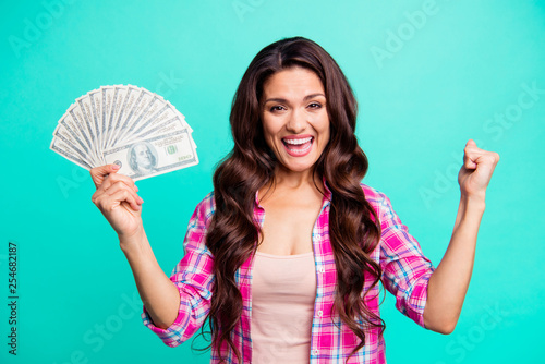 Close up photo beautiful she her lady hands arms hold fan bucks money look glad scream shout yell wear casual plaid checkered pink shirt outfit isolated teal bright vivid background