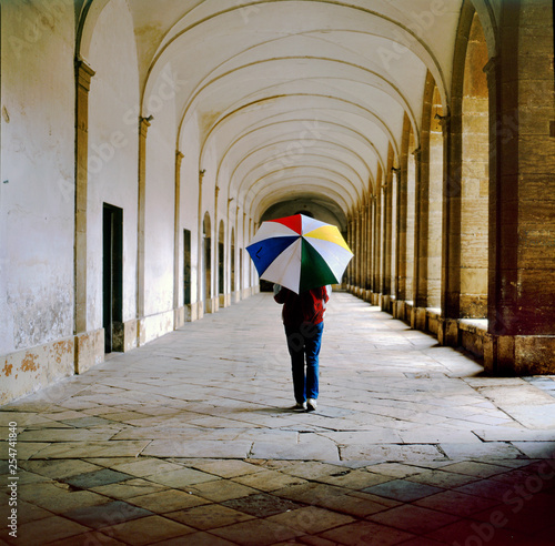 Lady with umbrella walking in the galleries