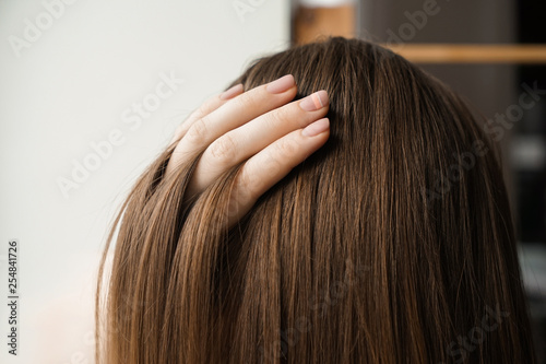 Young woman with healthy long hair, closeup