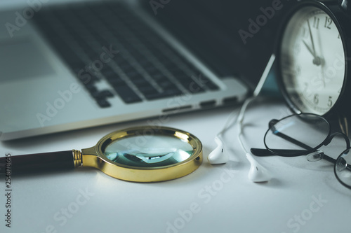 LAPTOP WITH MAGNIFYING GLASS CONCEPT