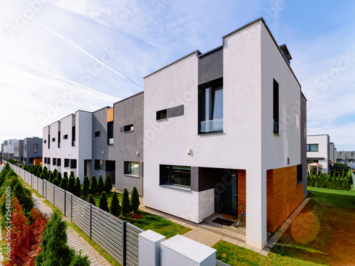 Apartment residential house building complex with gate sun light