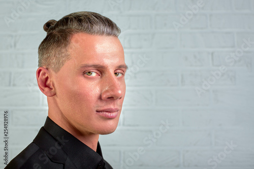 Close up side portrait of young, happy manager standing over grey background with copy space