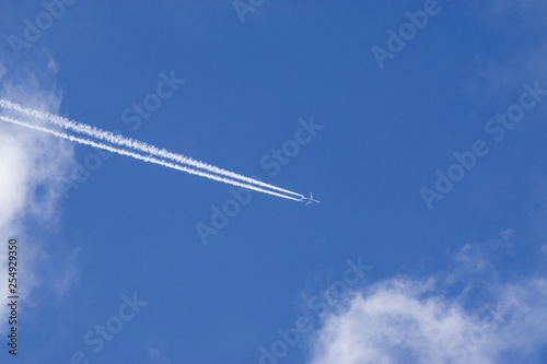 Aeroplane vapor trails in jet stream from jet aircraft.