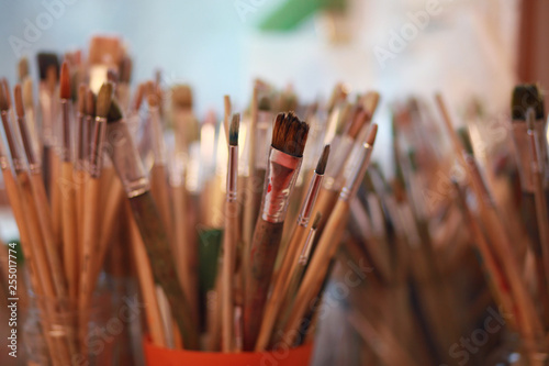 paint brushes in containers