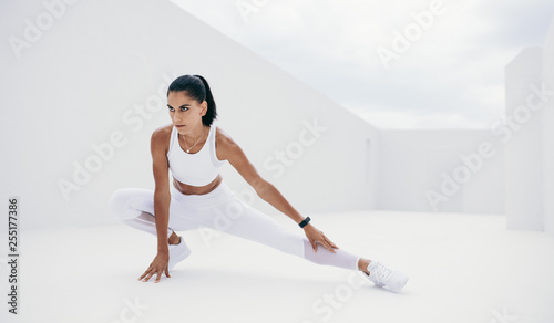 Female athlete doing warm up exercises