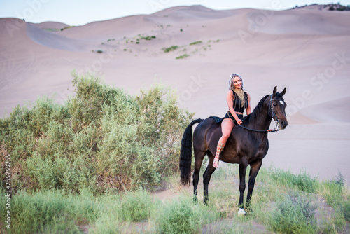 Arabian horse, a girl, and the desert