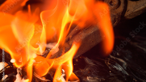 MACRO, DOF: Burning blade is swirled around the hot oil during heat treatment