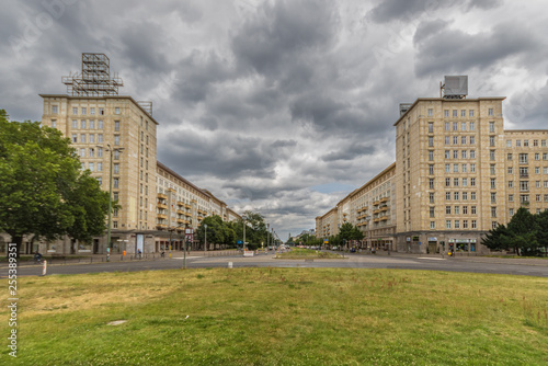 Berlin, Germany - main avenue during of the GDR (East Germany), Karl Marx Allee presents many beautiful buildings. Here in particular an example of its socialist architecture