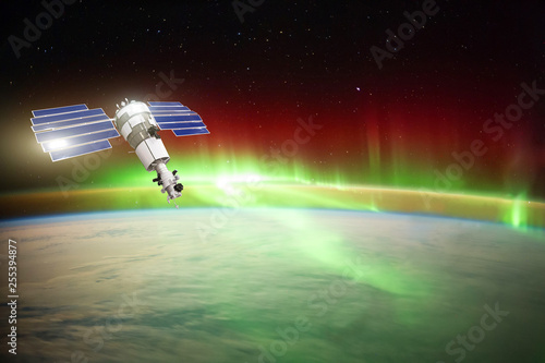 Satellite for observing aurora borealis in Earth orbit, measuring the flow of sun particles, the solar wind. Elements of this image furnished by NASA.