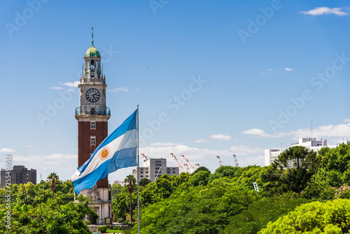 Torre Monumental (Torre de los Ingleses) clock tower in Retiro neighborhood, Buenos Aires, Argentina with the flag of Argentina