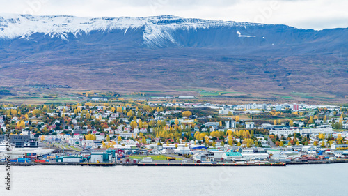 Beautiful scenery of Akureyri city from tourist viewpoint across the sea and Eyjafjordur fjord in iceland