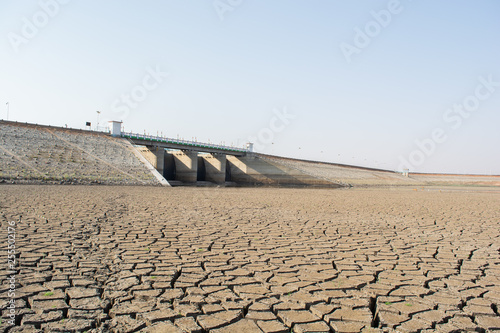 A dried up empty reservoir or dam during a summer heatwave, low rainfall and drought in north karnataka,India