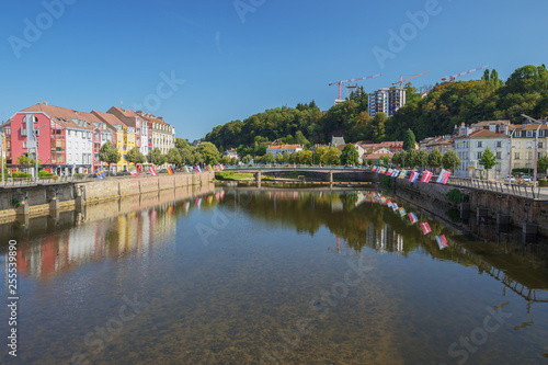The Moselle in Epinal with flags on both shores