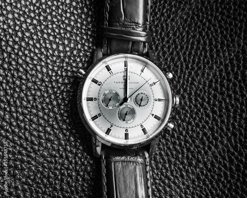 Watch on the black leather background 