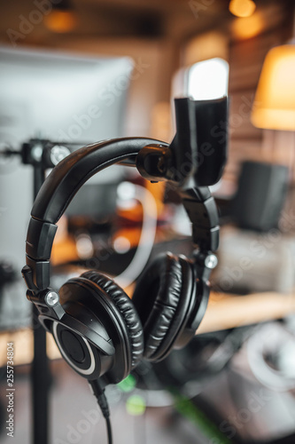Close up view on professional headphone in sound recording studio.
