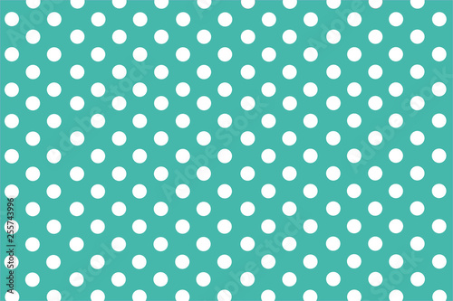 Turquoise background with symmetrical white polka dots