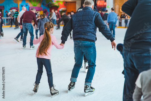 LVIV, UKRAINE - February 3, 2019: people skating on ski rink in city mall