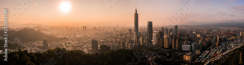 Aerial drone panorama photo - Sunset over the city of Taipei, Taiwan. Taipei 101 skyscraper featured. 