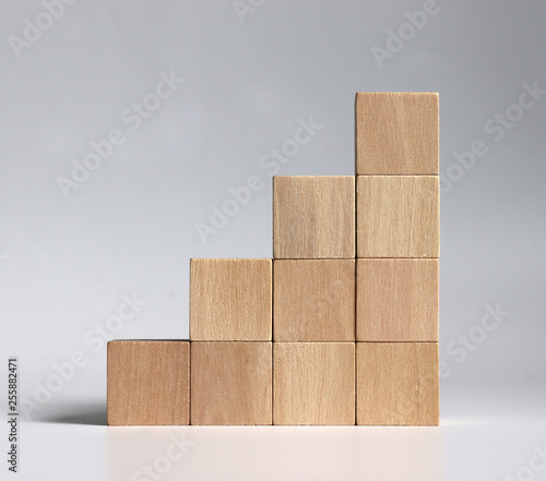 A stack of wooden blocks stacked in the shape of a staircase.