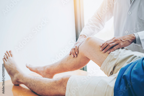 Physical Doctor consulting with patient Knee problems Physical therapy concept
