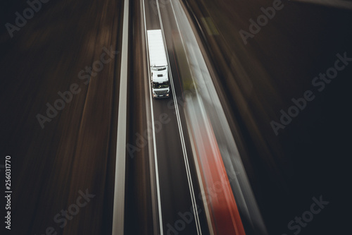 White truck tir speed transport goods on highway road street